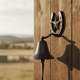 Horseshoe star farmhouse doorbell chime with cast iron bell, rustic outdoor setting
