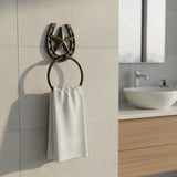Western cast iron star horseshoe towel ring with brown finish, mounted in bathroom