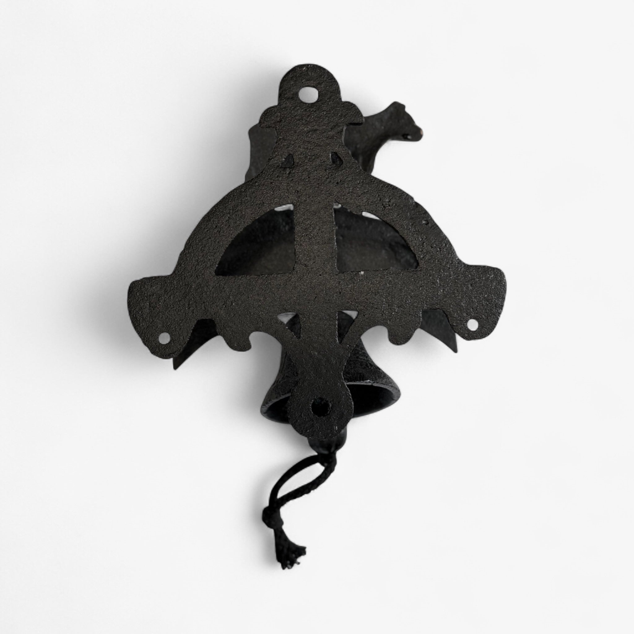 Decorative cast iron cross pendant with ornate cutout design and rope hanging loop in black finish