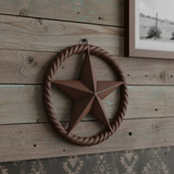 Rustic dark brown cast iron Texas star with twisted rope ring border, vintage western decor