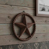 Rustic dark brown cast iron Texas star with twisted rope ring border, vintage western decor