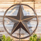 Twisted wire-accent barn star with brushed copper finish mounted on weathered wooden barn wall