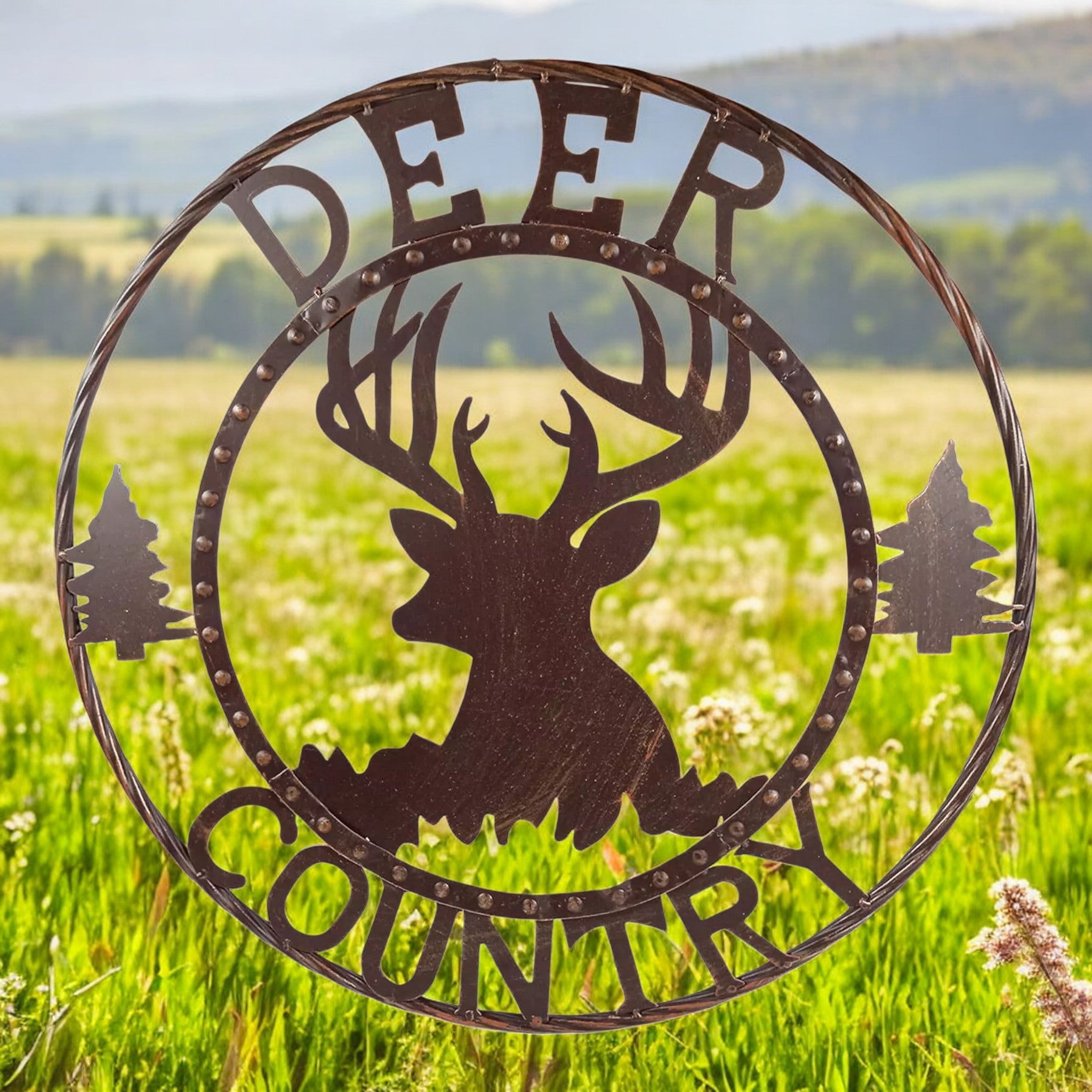 Rustic deer metal wall sign with country text and forest trees in 24-inch circular design, weathered brown finish