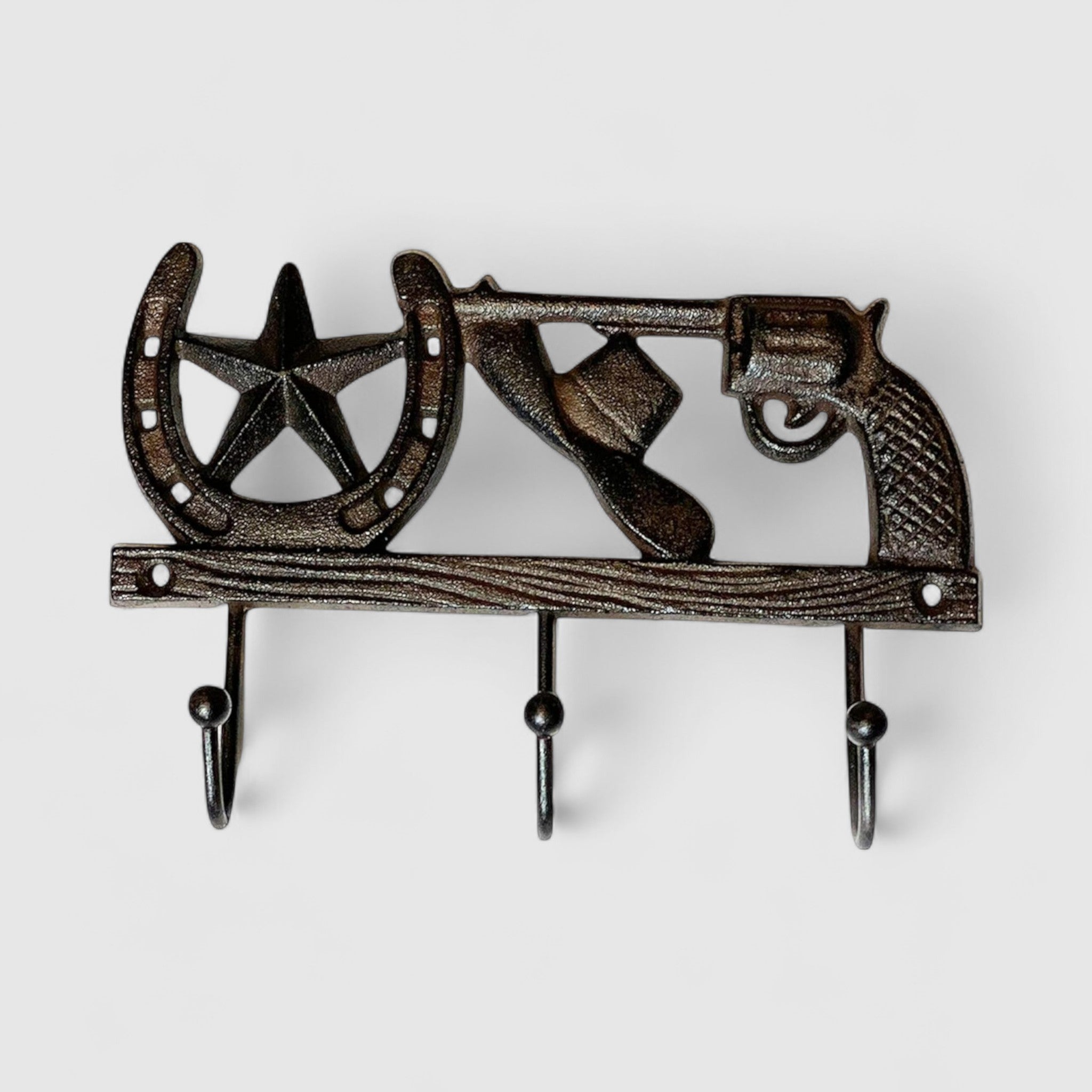 Single cast iron arrow hook with textured shaft and pointed arrowhead detail, dark finish
