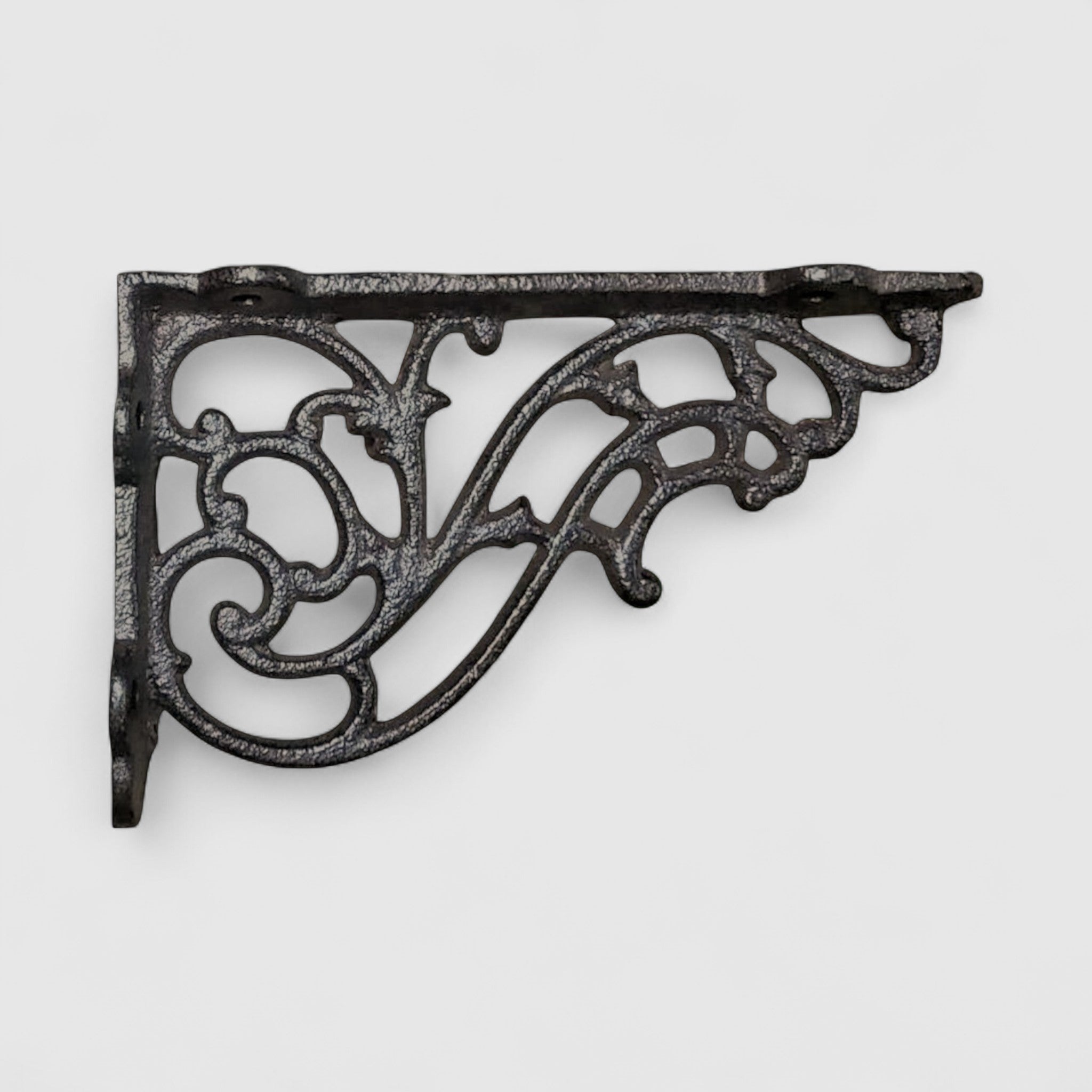 Ornamental black cast iron bracket closeup showing detailed scrollwork pattern and finish