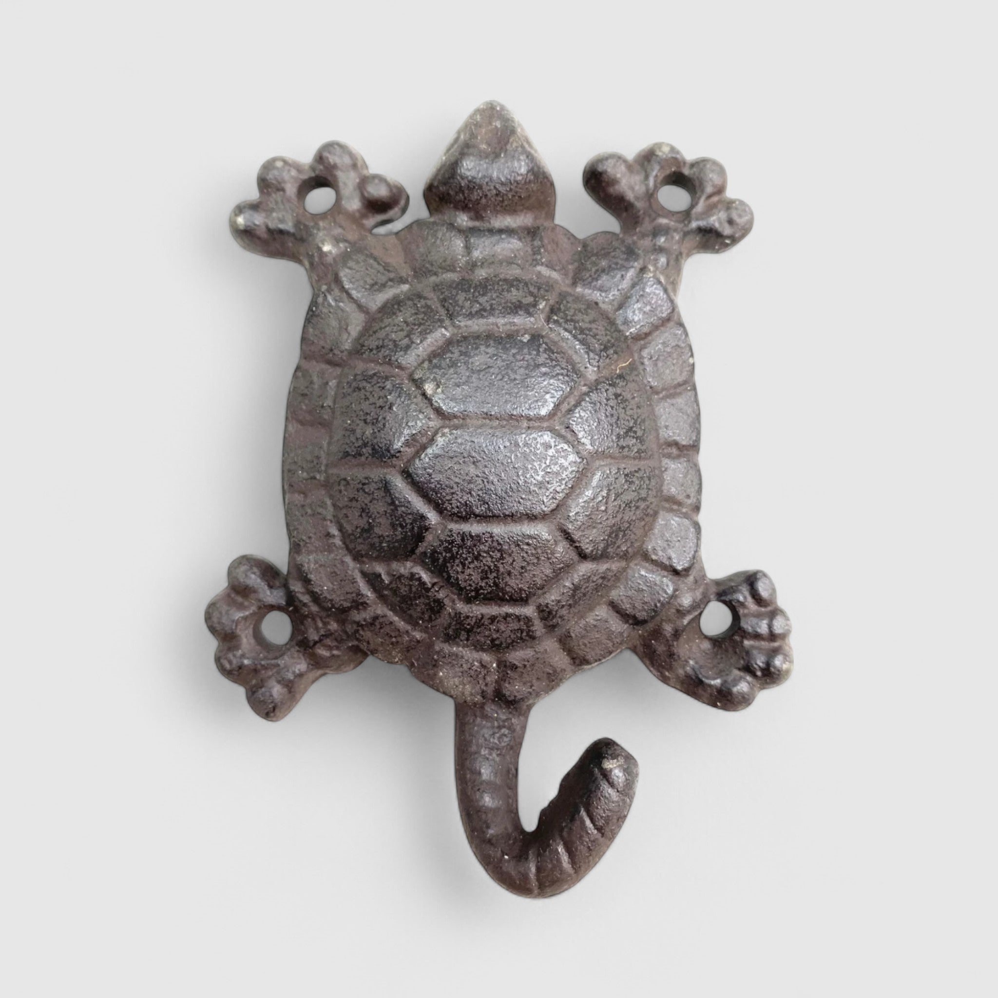 Detailed cast iron turtle hook showing realistic shell texture and mounting holes
