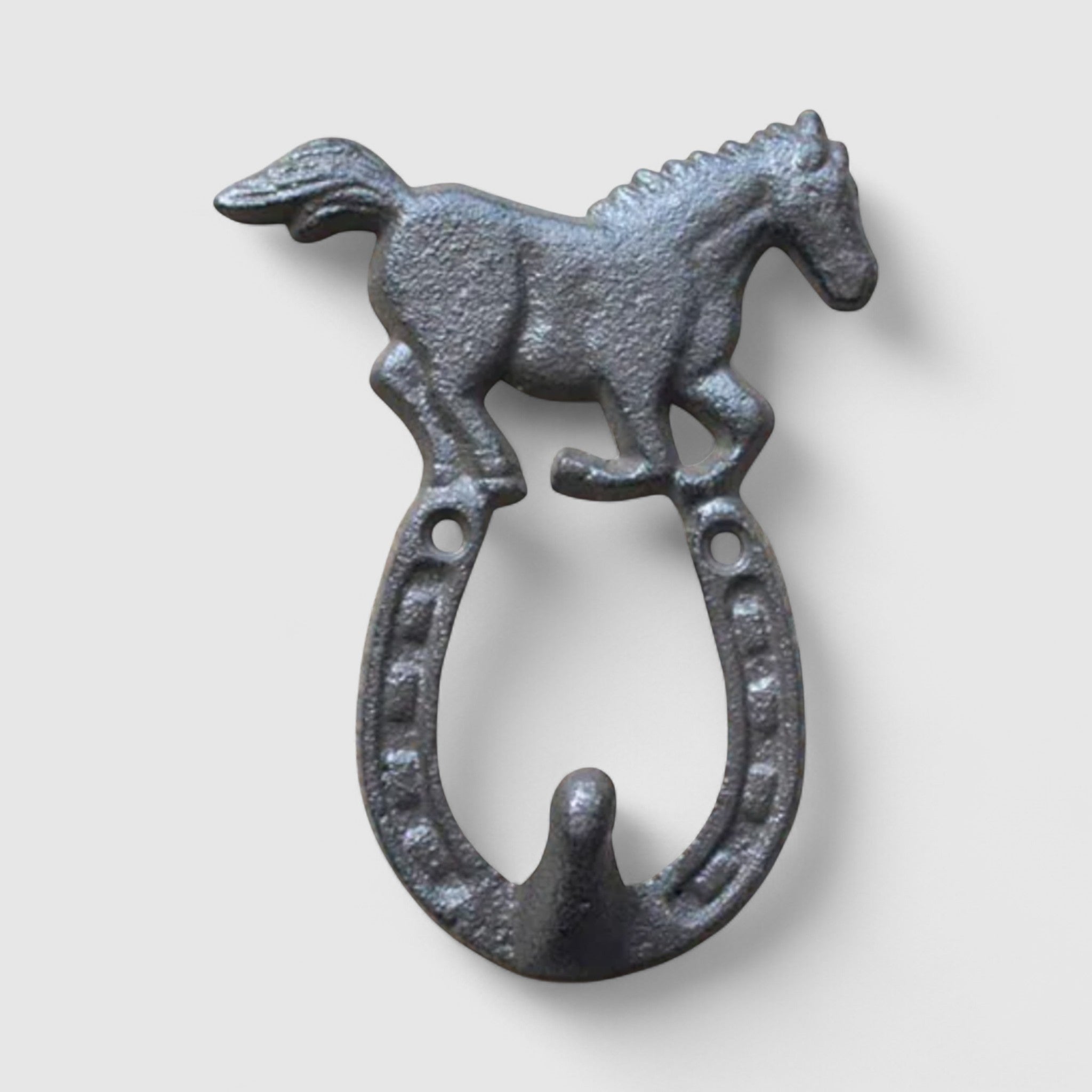 Close-up of textured cast iron horse sculpture showing detailed metal finish