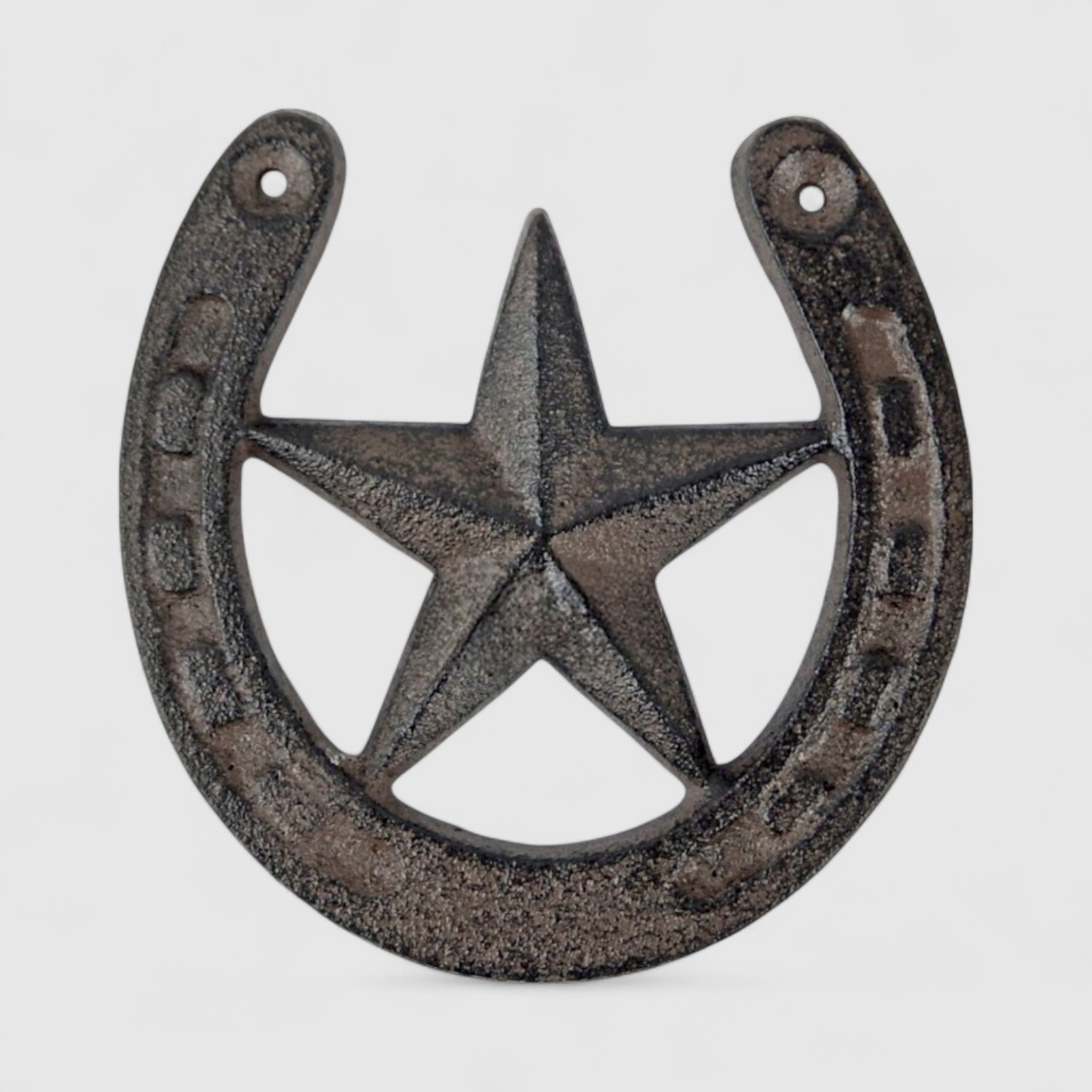Decorative cast iron horseshoe with star cutout, vintage Western style wall hanging