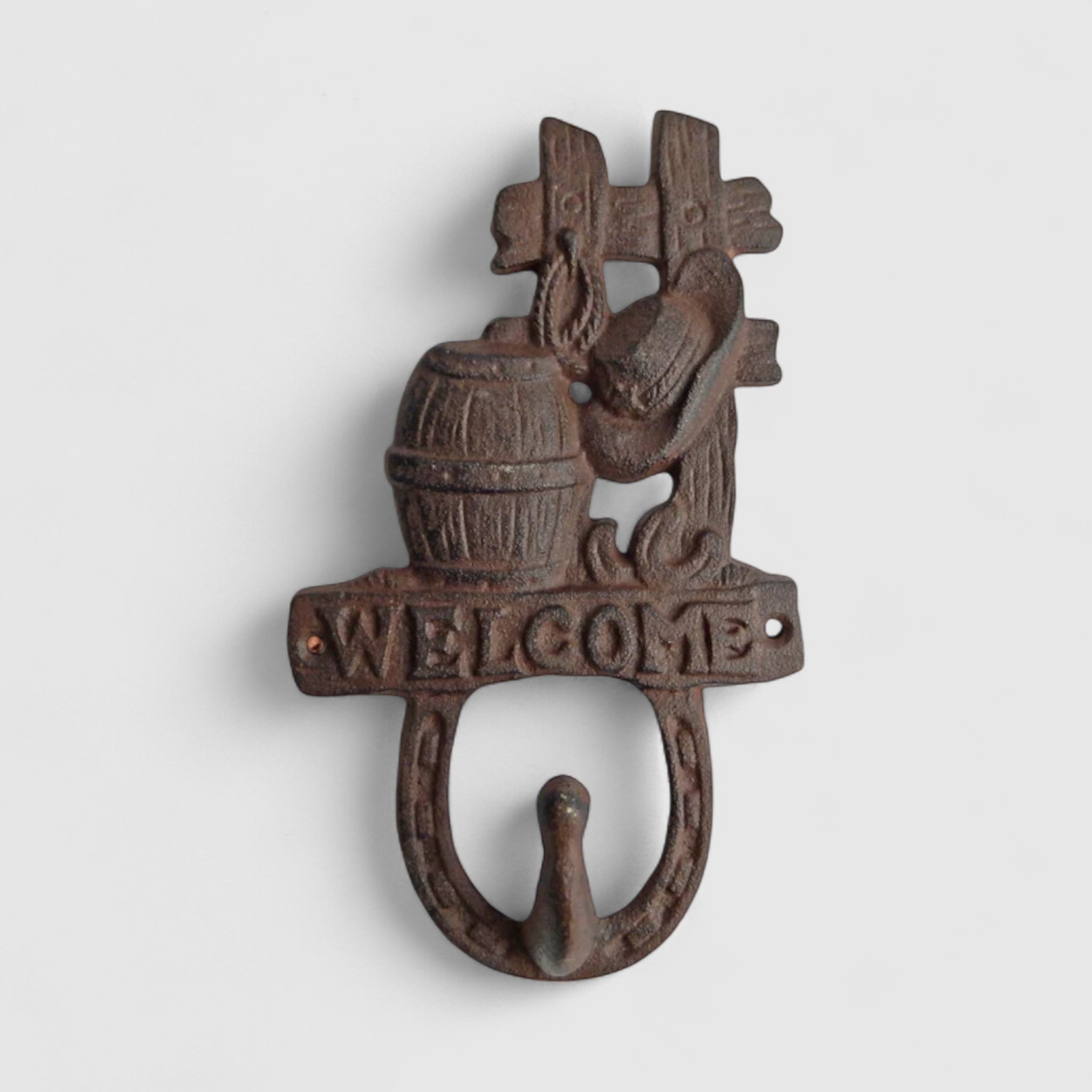 Black cast iron barrel hook wall hanging with welcome sign and towel rail