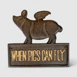 Dark bronze cast iron pig figurine with wings and textured details, standing on base plate