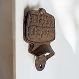 Rustic cast iron bar bottle opener, vintage tavern accessory with detailed face design