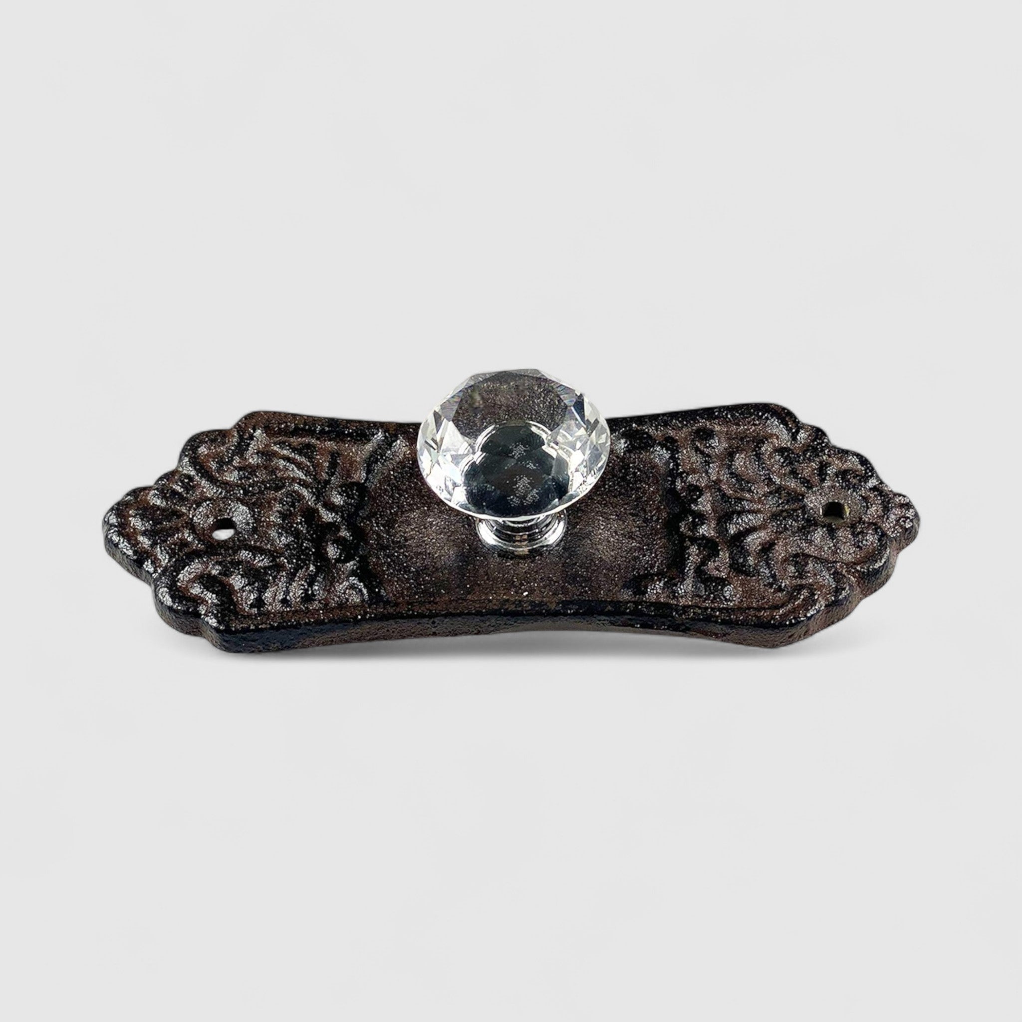 Cream painted cast iron cabinet knob with crystal top on wooden furniture drawer