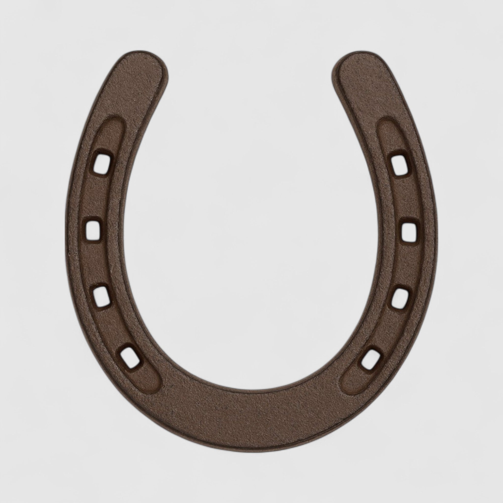 Brown cast iron horseshoe charm with square nail holes, isolated on white background