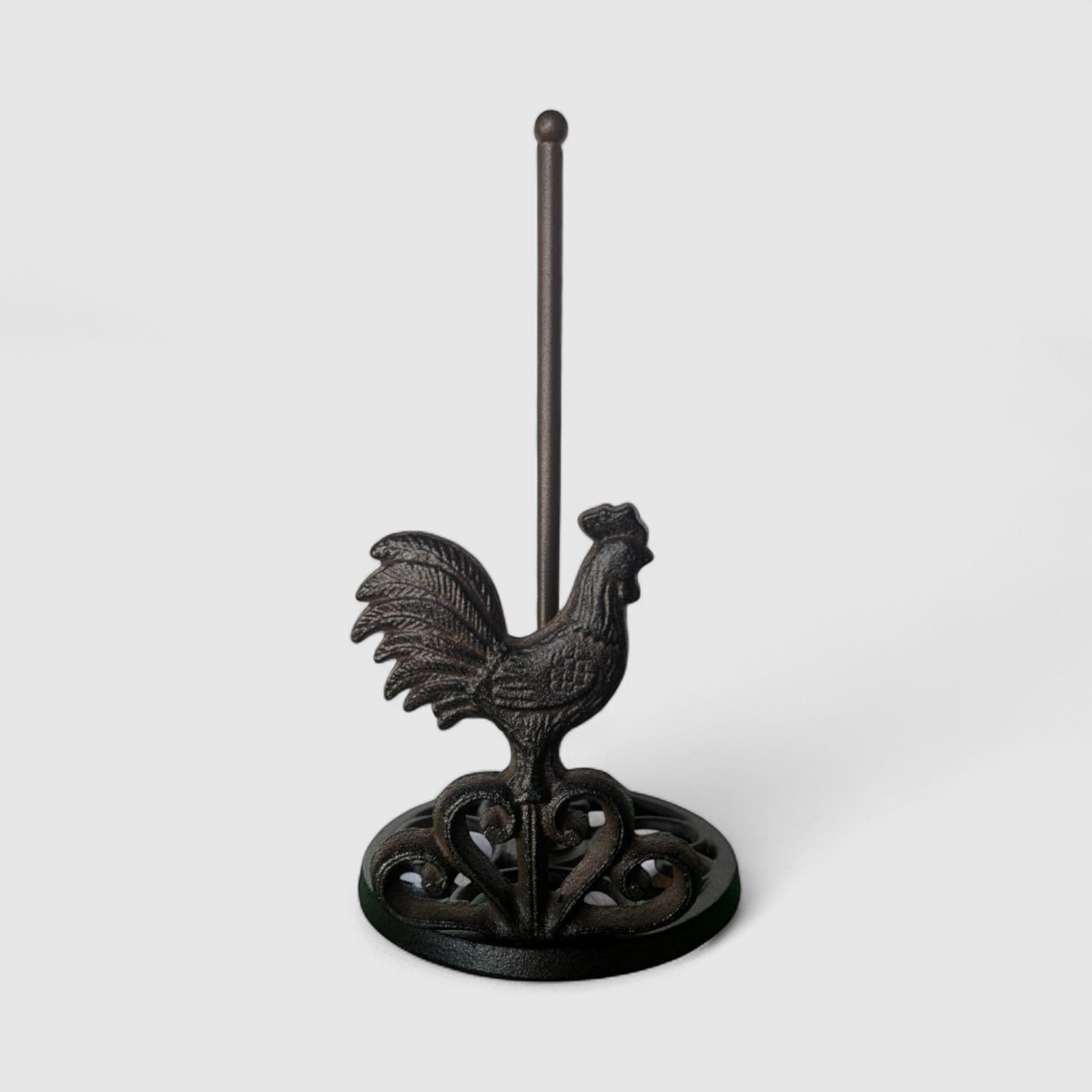 Rustic reddish-brown cast iron rooster paper towel holder with curved decorative arms
