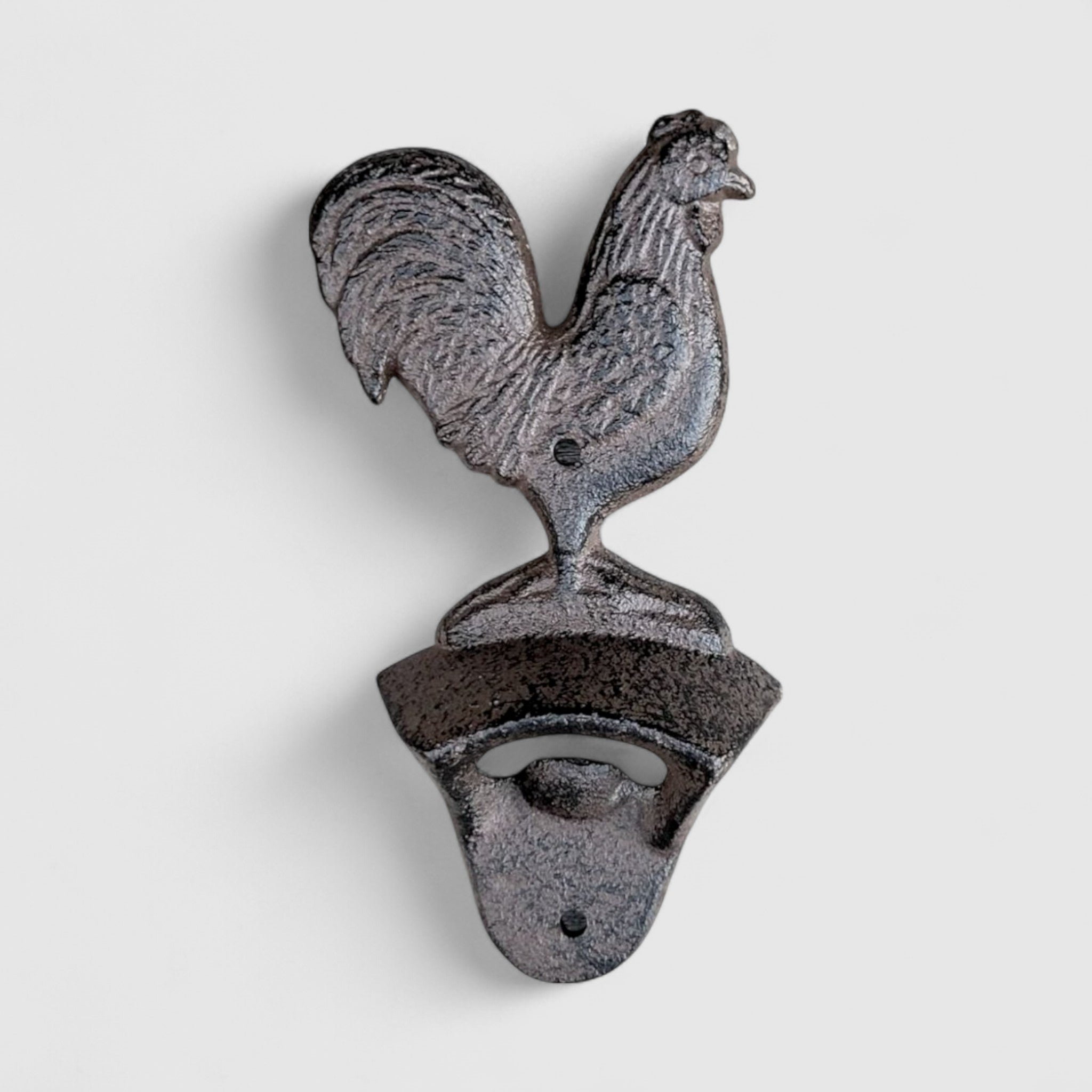 Antique gray cast iron rooster bottle opener shown from front with ornate base