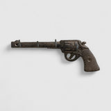 Vintage cast iron revolver gun hook with dual key pegs, antique bronze textured finish