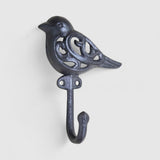 Decorative cast iron bird hook mounted on wall black iron with nature-inspired filigree pattern