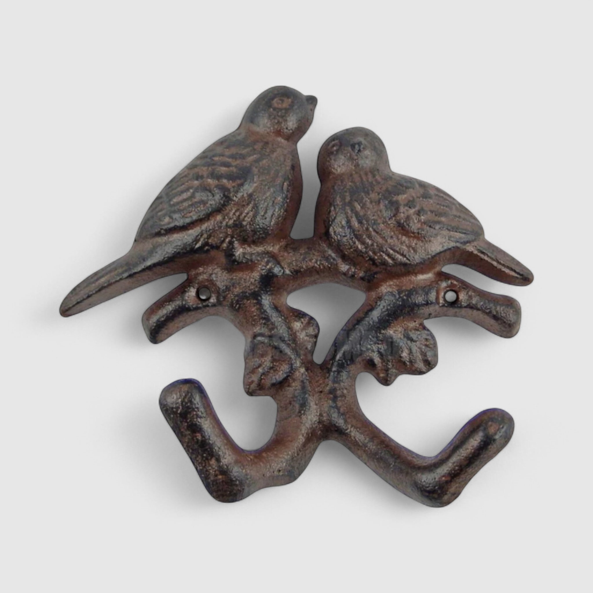 Dark brown patina cast iron dual birds on branch hook with natural weathered texture