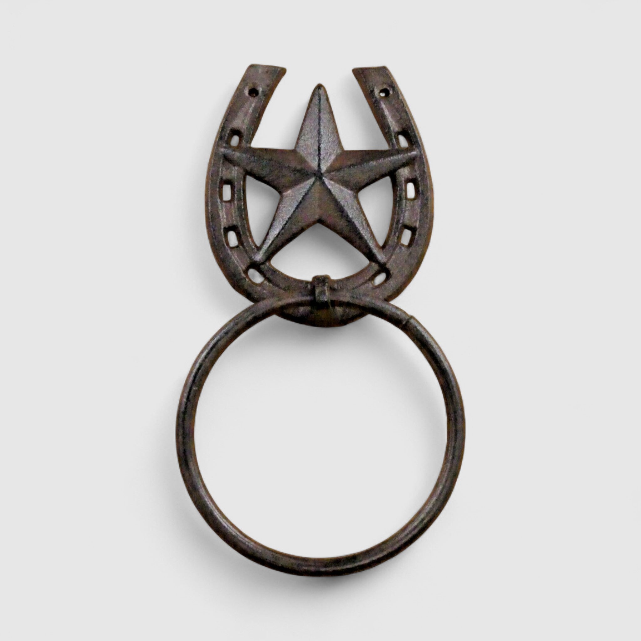 Bronze cast iron towel ring with star horseshoe detail, close-up view showing rustic patina