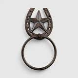 Bronze cast iron towel ring with star horseshoe detail, close-up view showing rustic patina