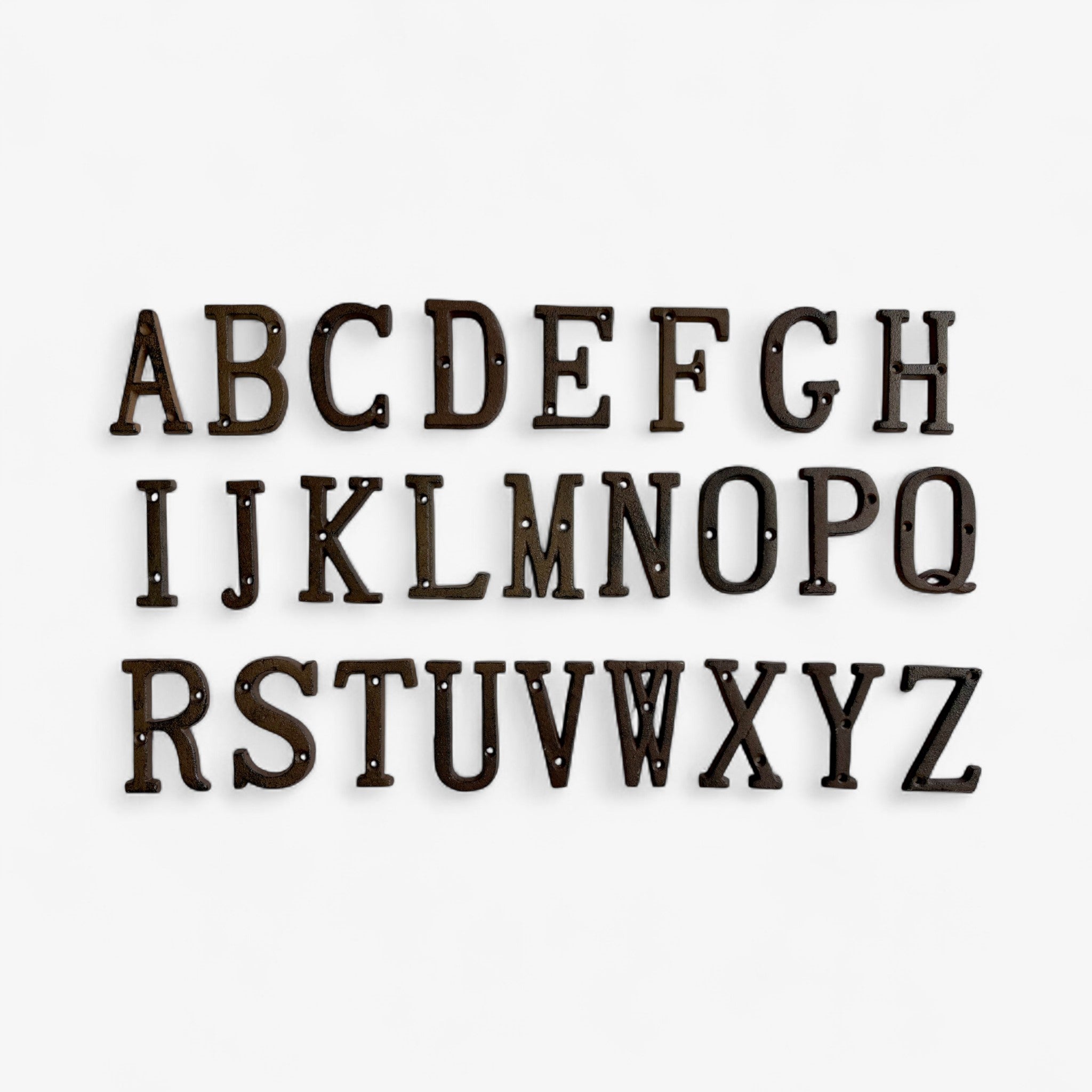 Antique cast iron letter R, weathered brown patina with mounting holes