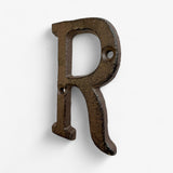 All 26 cast iron alphabet letters A-Z, dark vintage finish on white background