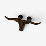 Bronze cast iron longhorn skull drawer pull with extended horns, front view