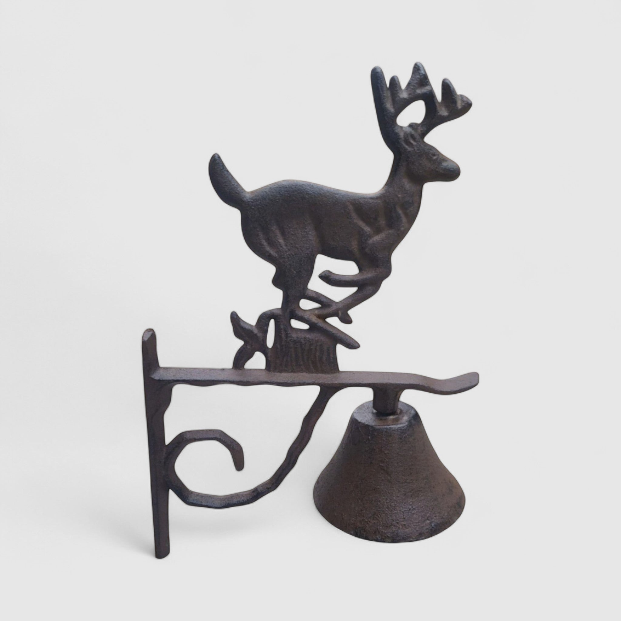Sculptural cast iron deer doorbell with buck figurine patina finish displayed as functional wall-mounted chime