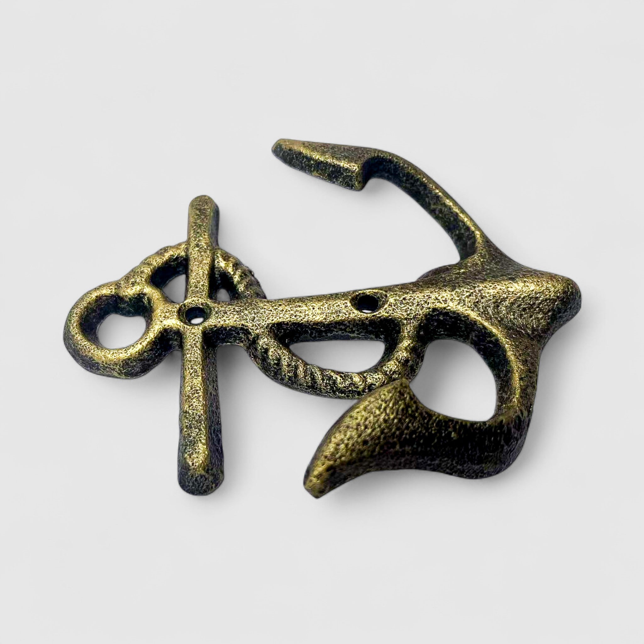 Distressed gold-tone cast iron anchor wall hook, ornate curved design