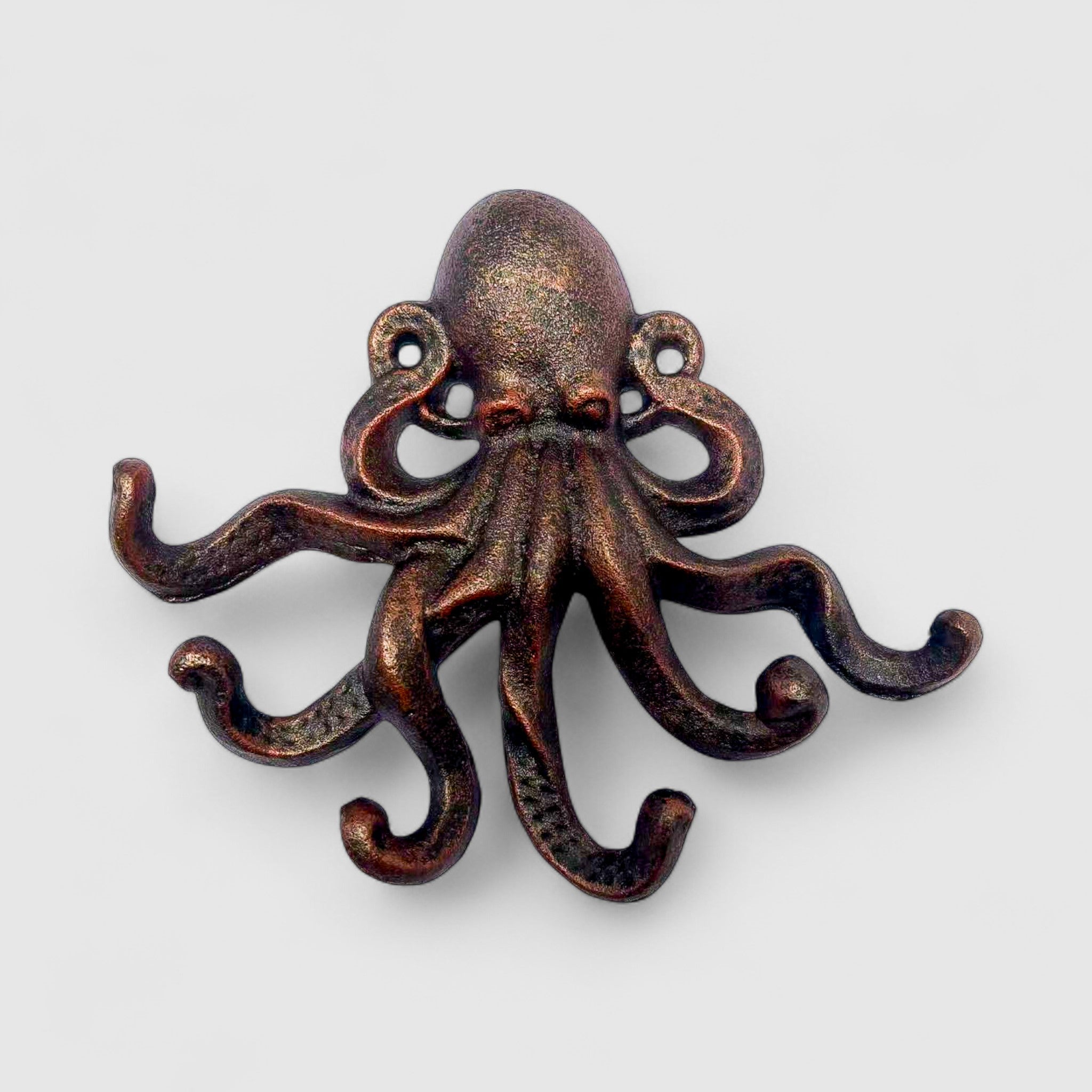 Copper cast iron octopus wall decor showing front face with textured suction cups