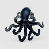 Dark cast iron octopus hook with matte finish and extended curled tentacle arms