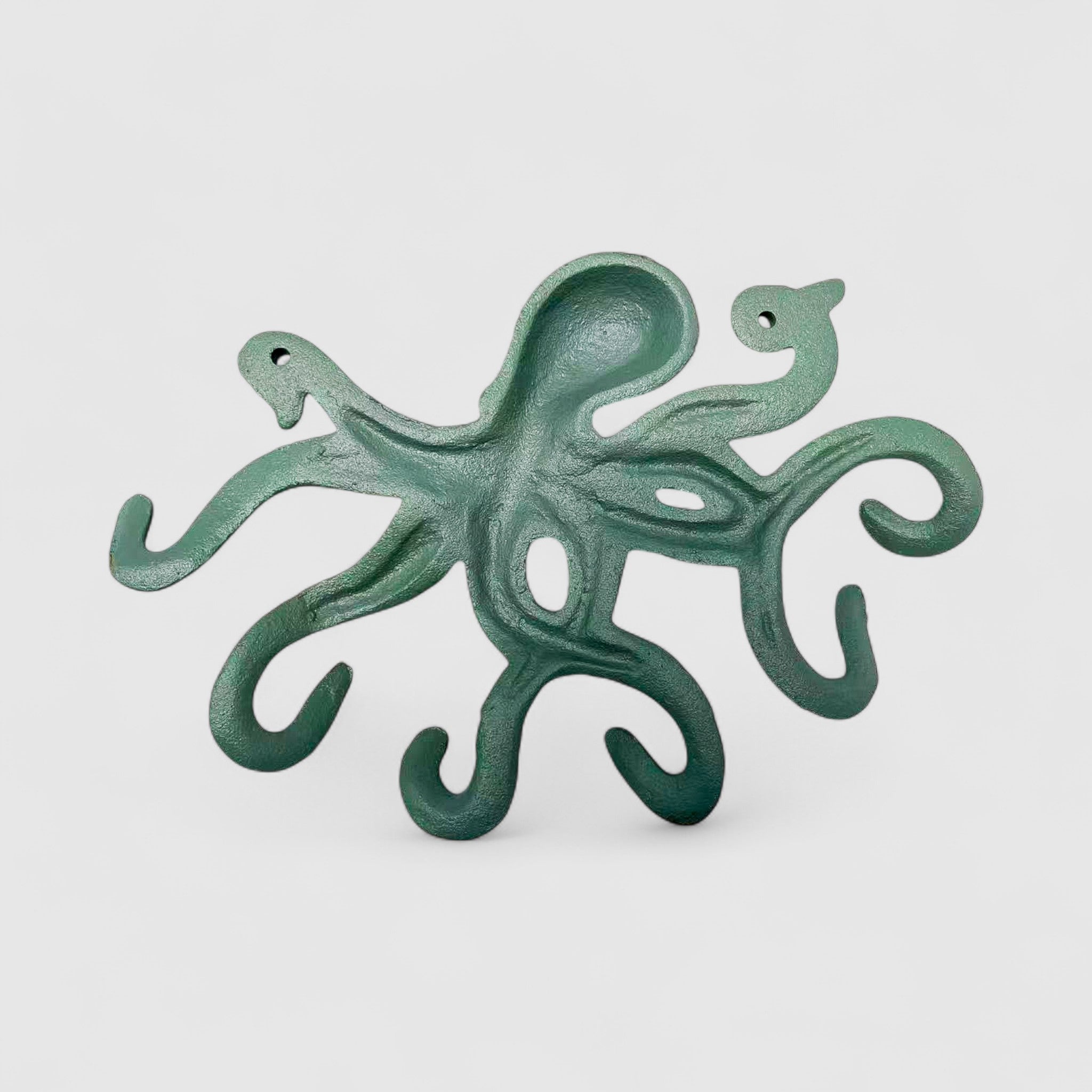 Green bronze octopus cast iron wall decor with smooth curved arms and aged weathered finish