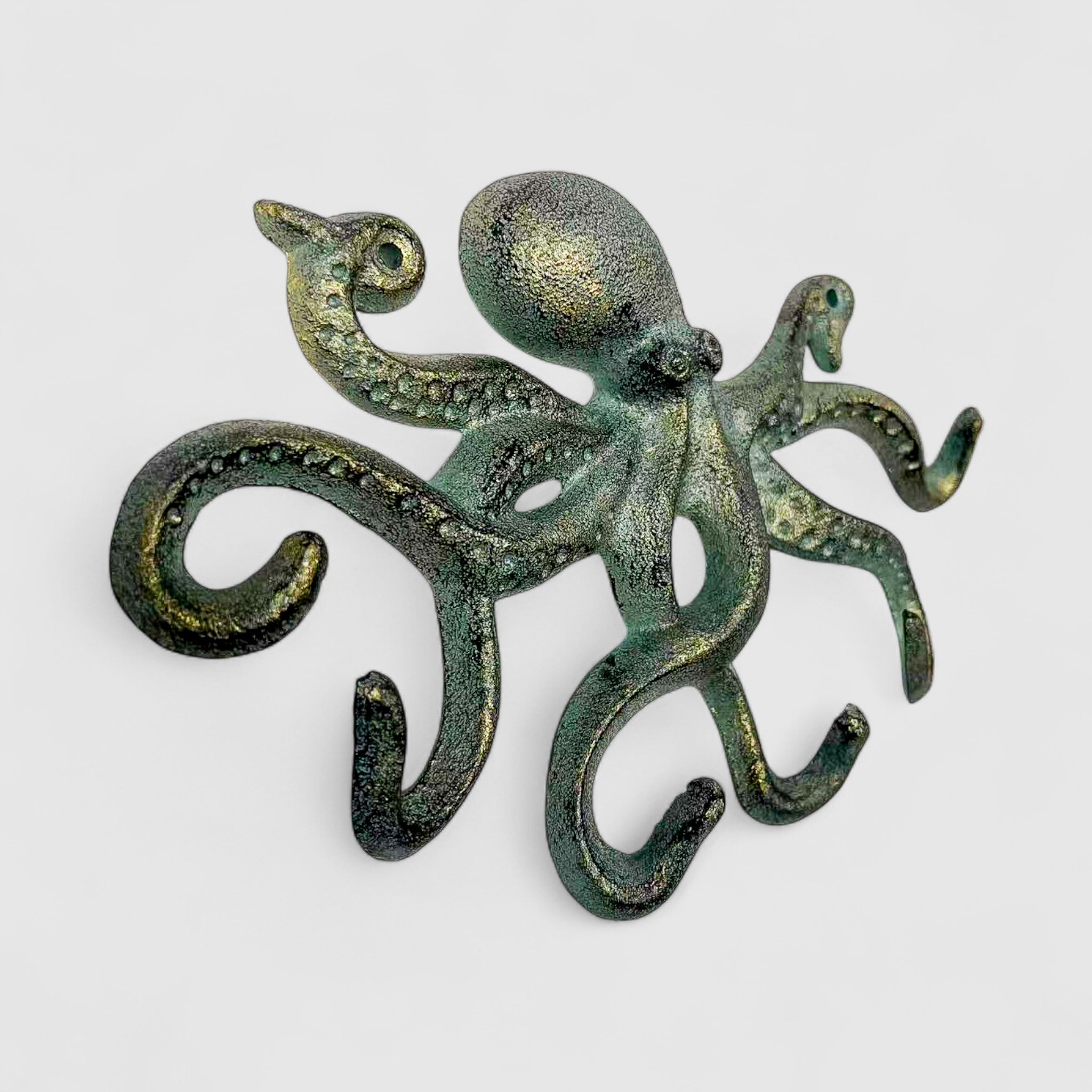 Green bronze octopus wall decor cast iron with detailed eye and textured arms oxidized