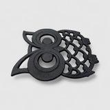 Cast iron owl trivet side view, dark finish with openwork wing and body details