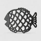 Front-view textured dark iron fish-shaped trivet with detailed scale pattern cutouts