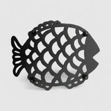 Side angle black cast iron fish trivet showing dimensional relief and scale texture detail