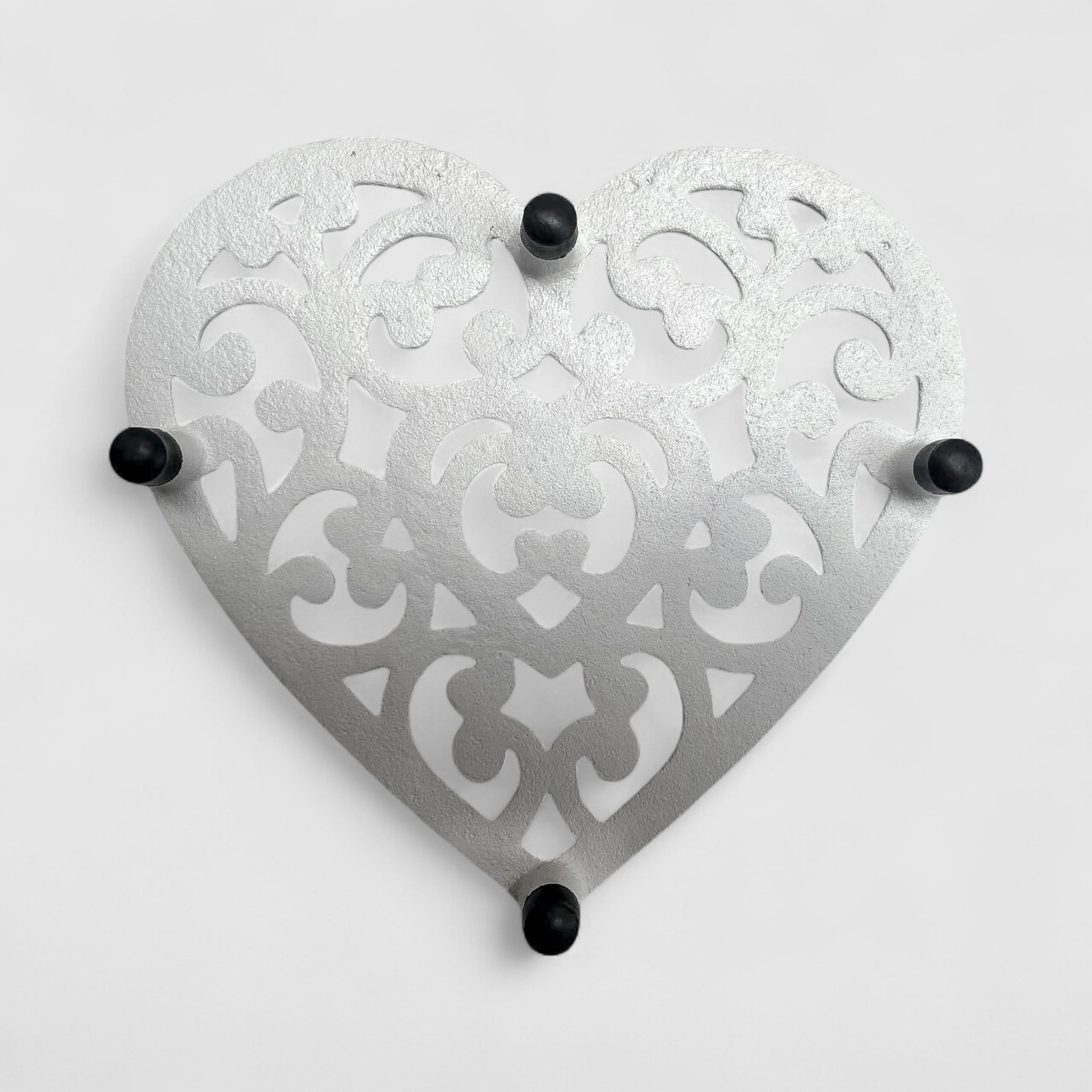 Cast iron heart trivet with black feet, vintage white finish ornate kitchen accent