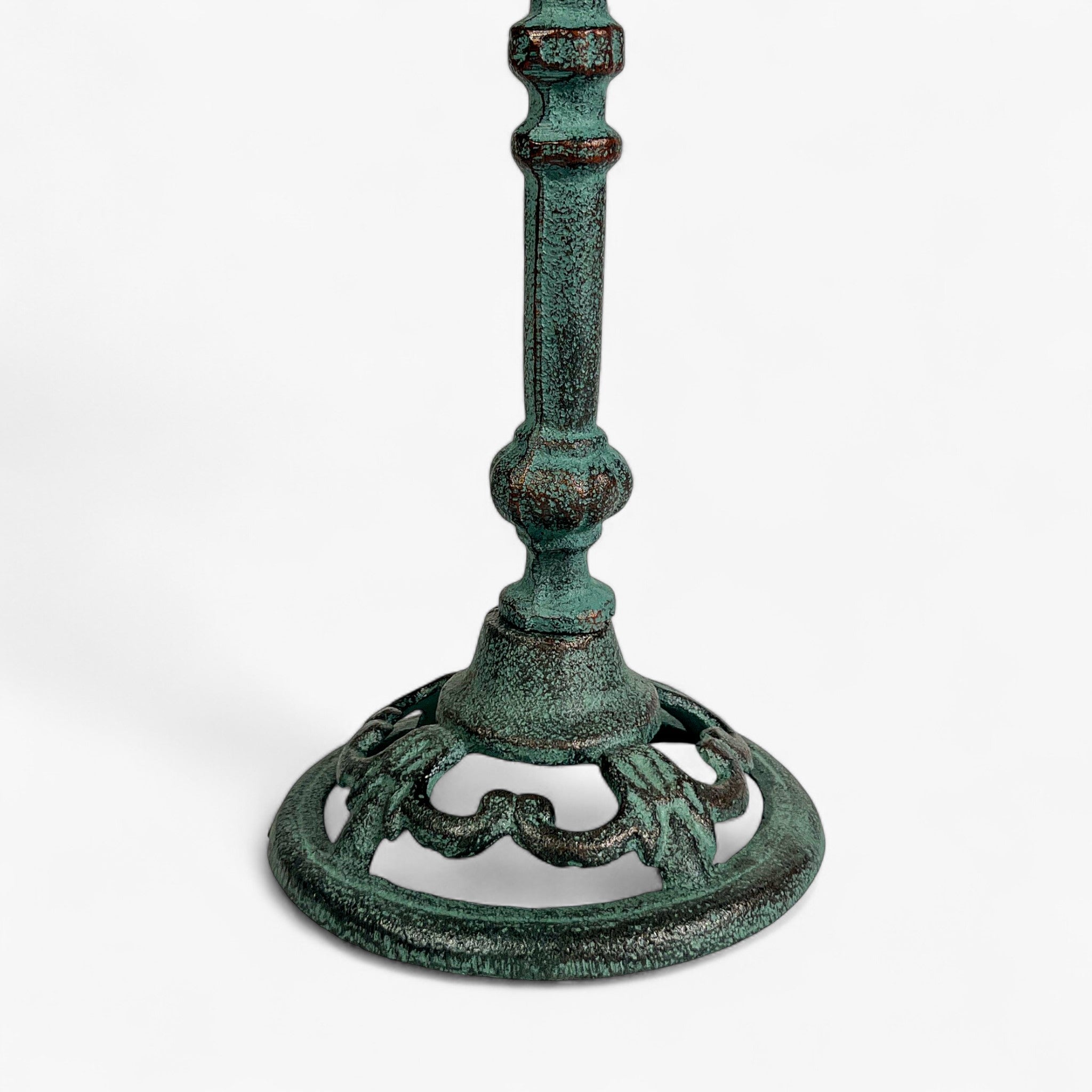 Cast iron pedestal bird bath full view with verdigris patina, decorative stem, and ornamental tripod base