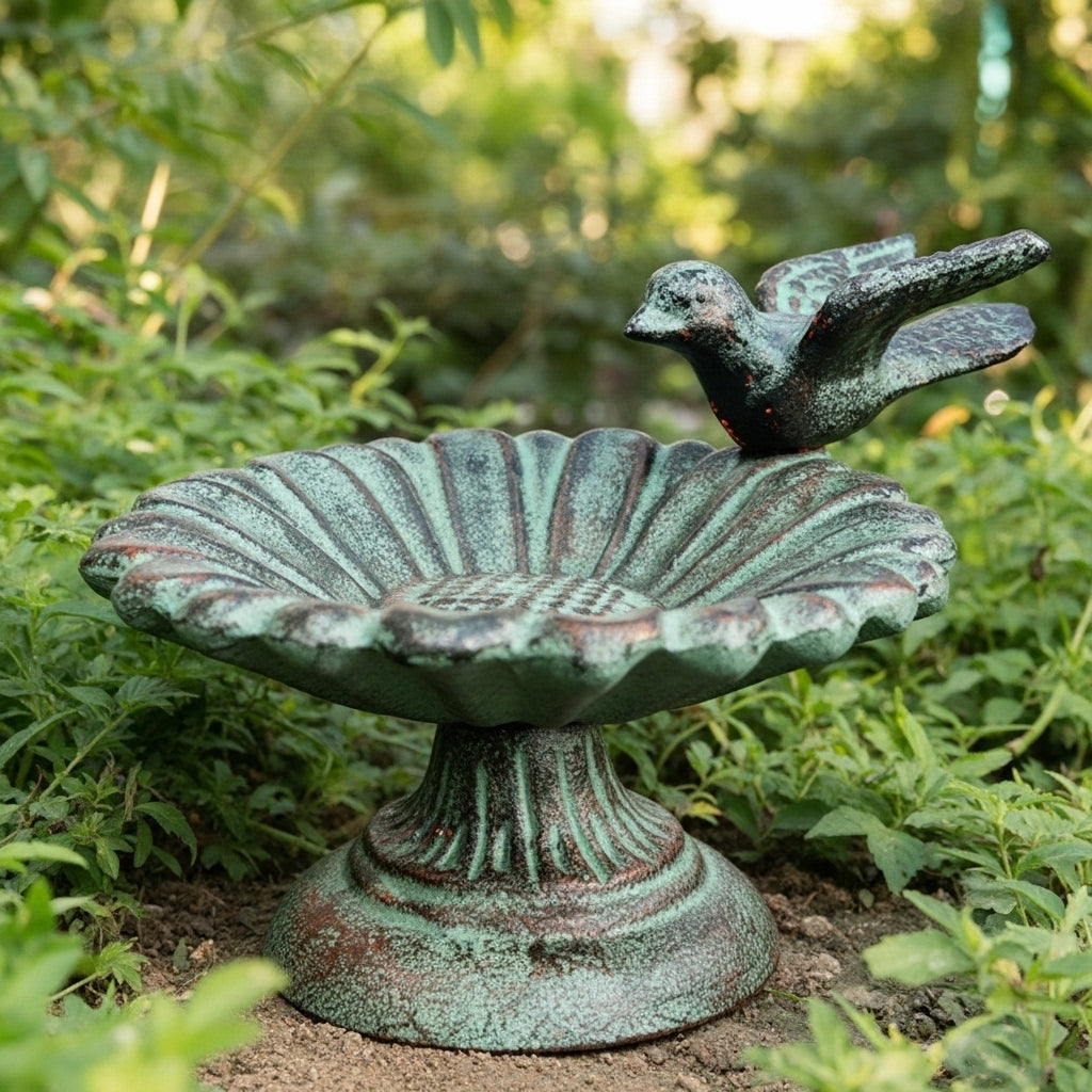 Verdigris cast iron sunflower bird bath with pedestal base and perched bird, full garden view