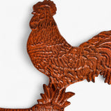 Side profile of rustic cast iron rooster plant hanger bracket with scrolled feet