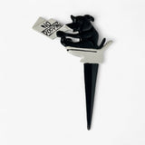 Black and white cast iron dog holding No Pooping sign, stake garden decor