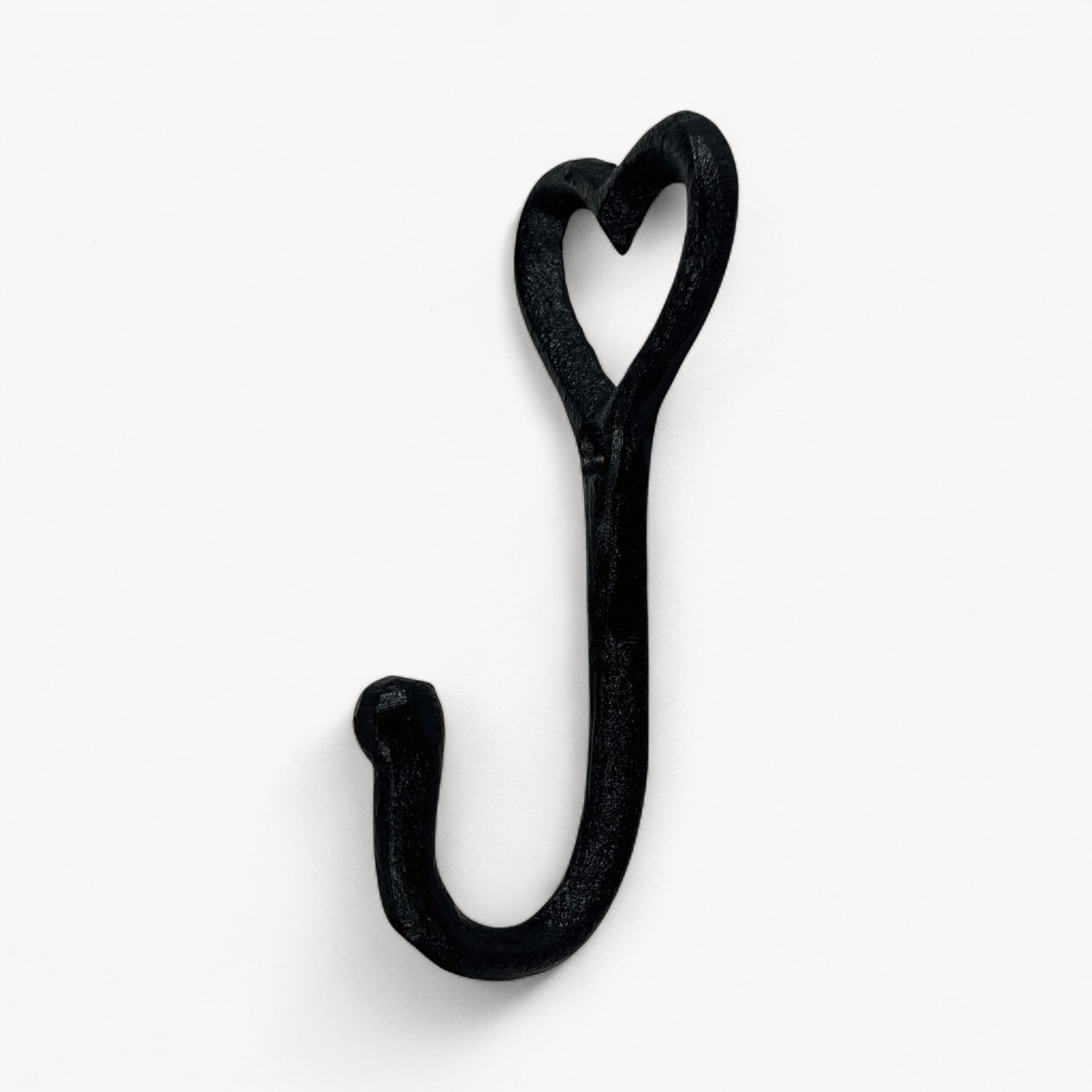 Black textured cast iron heart shaped hook with curved handle and hanging loop