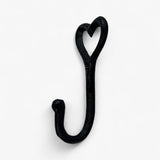 Black textured cast iron heart shaped hook with curved handle and hanging loop