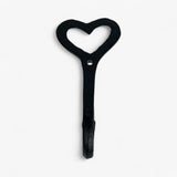 Black cast iron heart wall hook with mounting hole, rustic finish decorative hanger