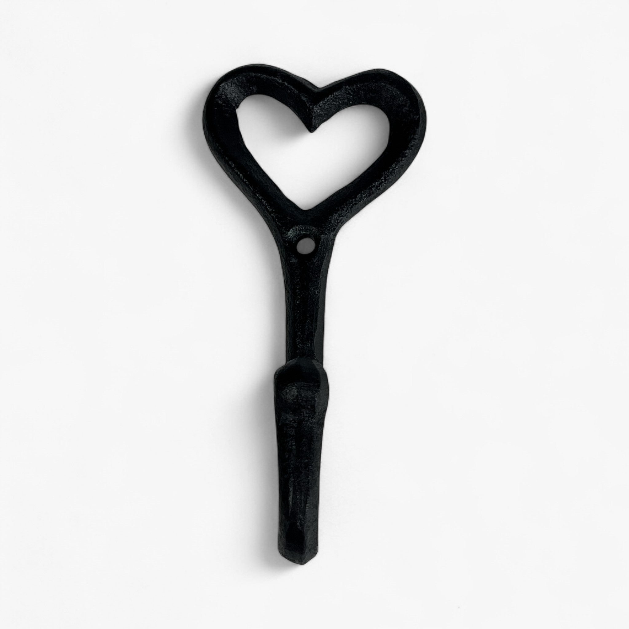 Black cast iron decorative heart hook with rounded handle, detailed weathered texture