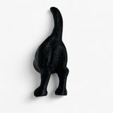 Black cast iron dog hook side profile, curved tail design, rustic metal