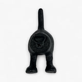 Black cast iron dog tail wall hook with rustic textured finish, wall-mounted home decor accent