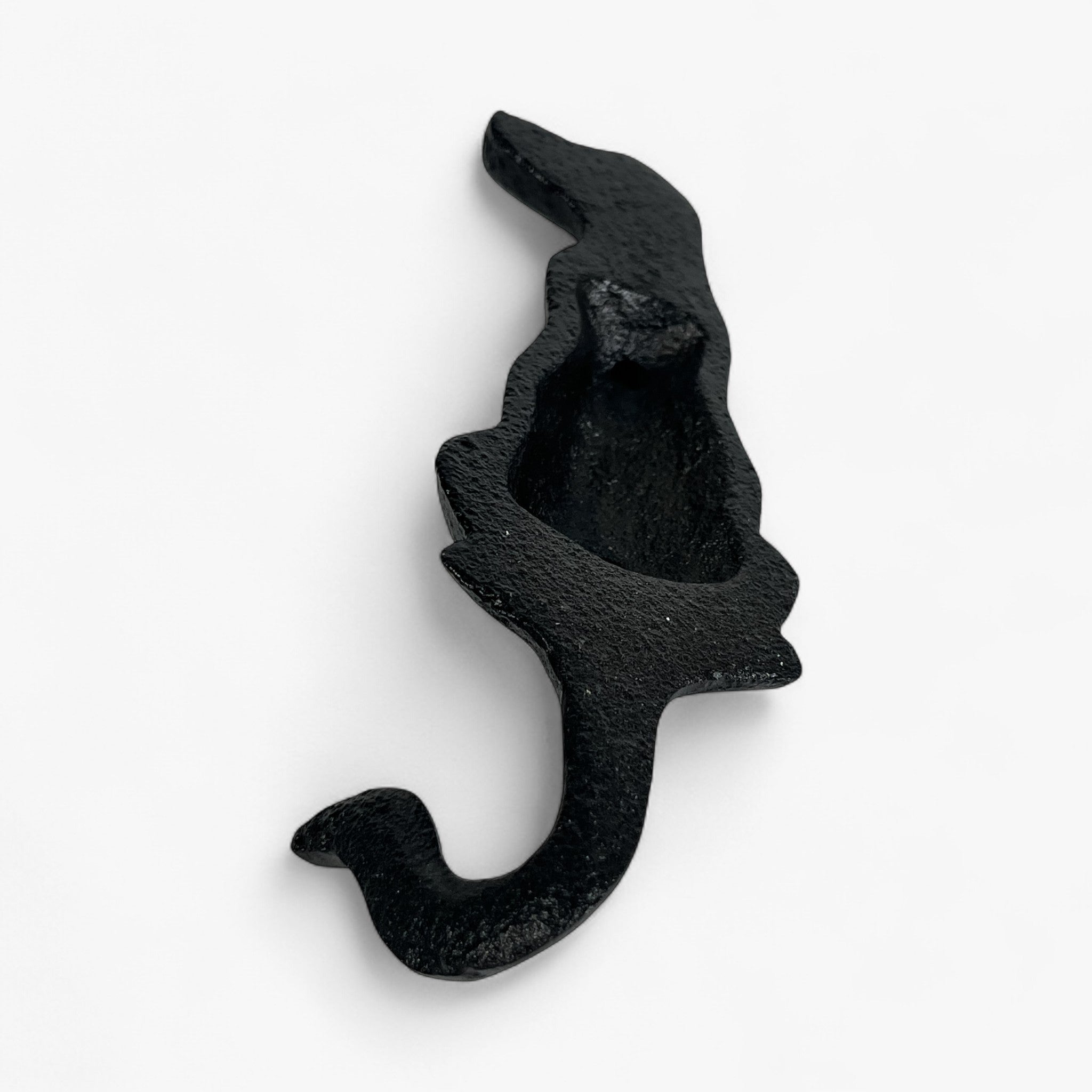 Cast iron dog head and neck wall mount detail, side angle showing textured black surface