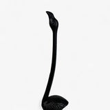 Close-up black cast iron flamingo toilet paper holder showing textured feather finish
