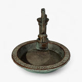 Ornamental cast iron pump bird bath with verdigris finish, decorative rim trim, top view